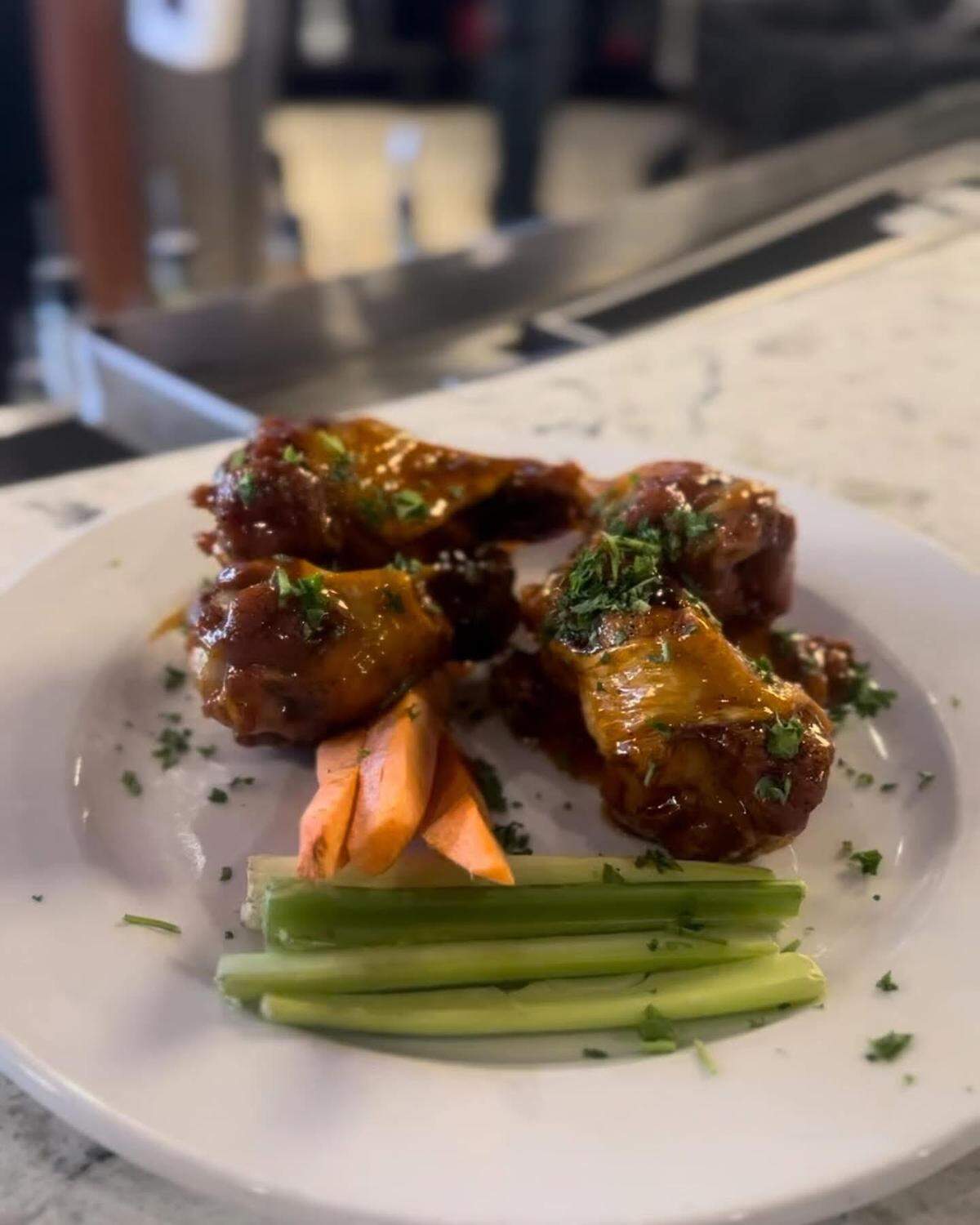 Bearfoot Tavern in downtown Macon is opening soon a food truck that will be stationed in front of the gastropub with seating and heaters while it remains temporarily closed for a remodel following a catastrophic roof collapse. The food truck will feature new and staple menu items like these barbecue flavored wings.
