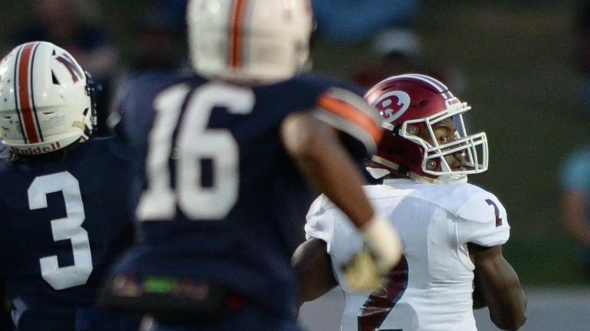 Warner Robins receiver Marcayll Jones (2) looks over his shoulder as he glides into the end zone with a long pass from Dylan Fromm to answer Northside’s early lead. The Demons ended up besting the Eagles 39-34.