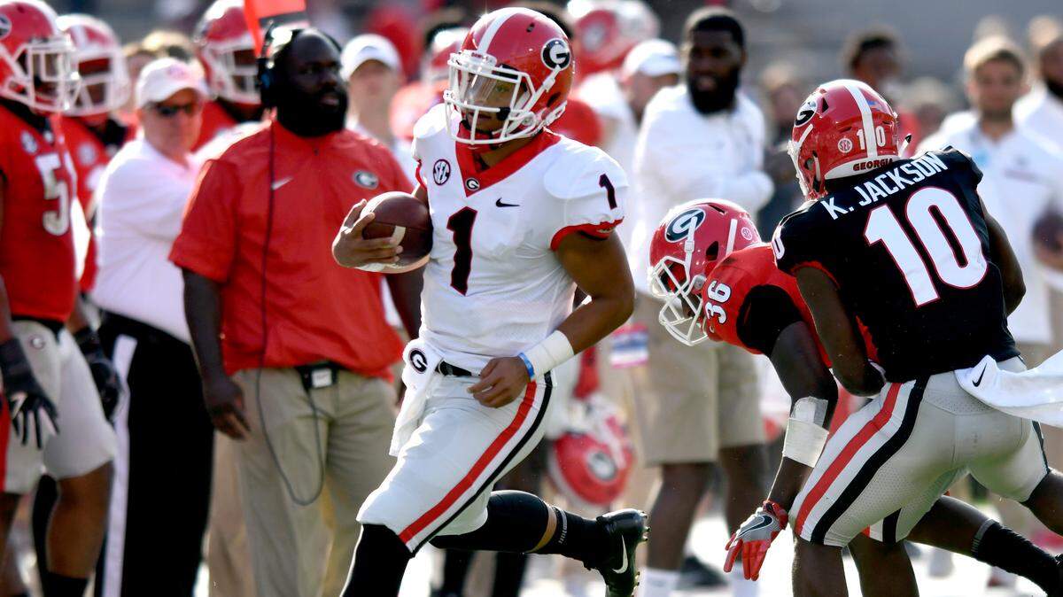 Georgia quarterback Justin Fields (1) scrambles for a first down at G-Day.