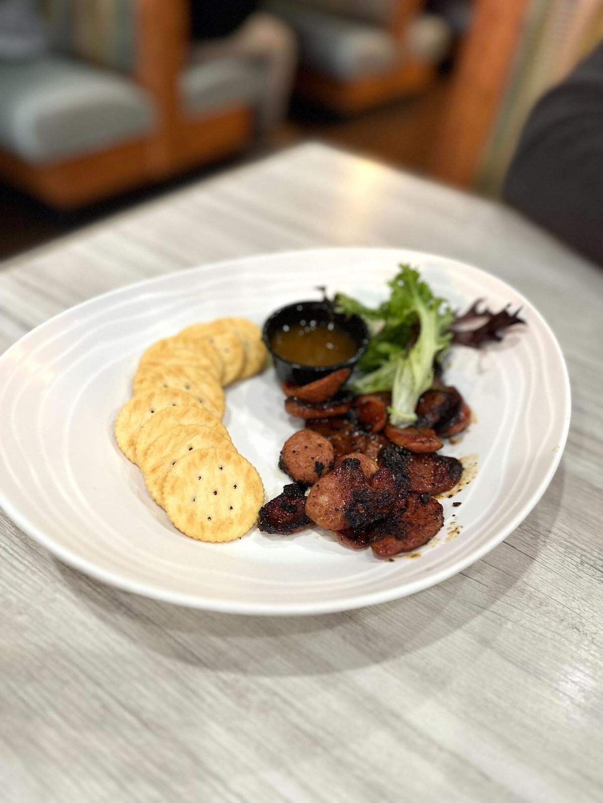 The Jezebel Sausage appetizer at Kudzu Seafood Company is packed with flavor.