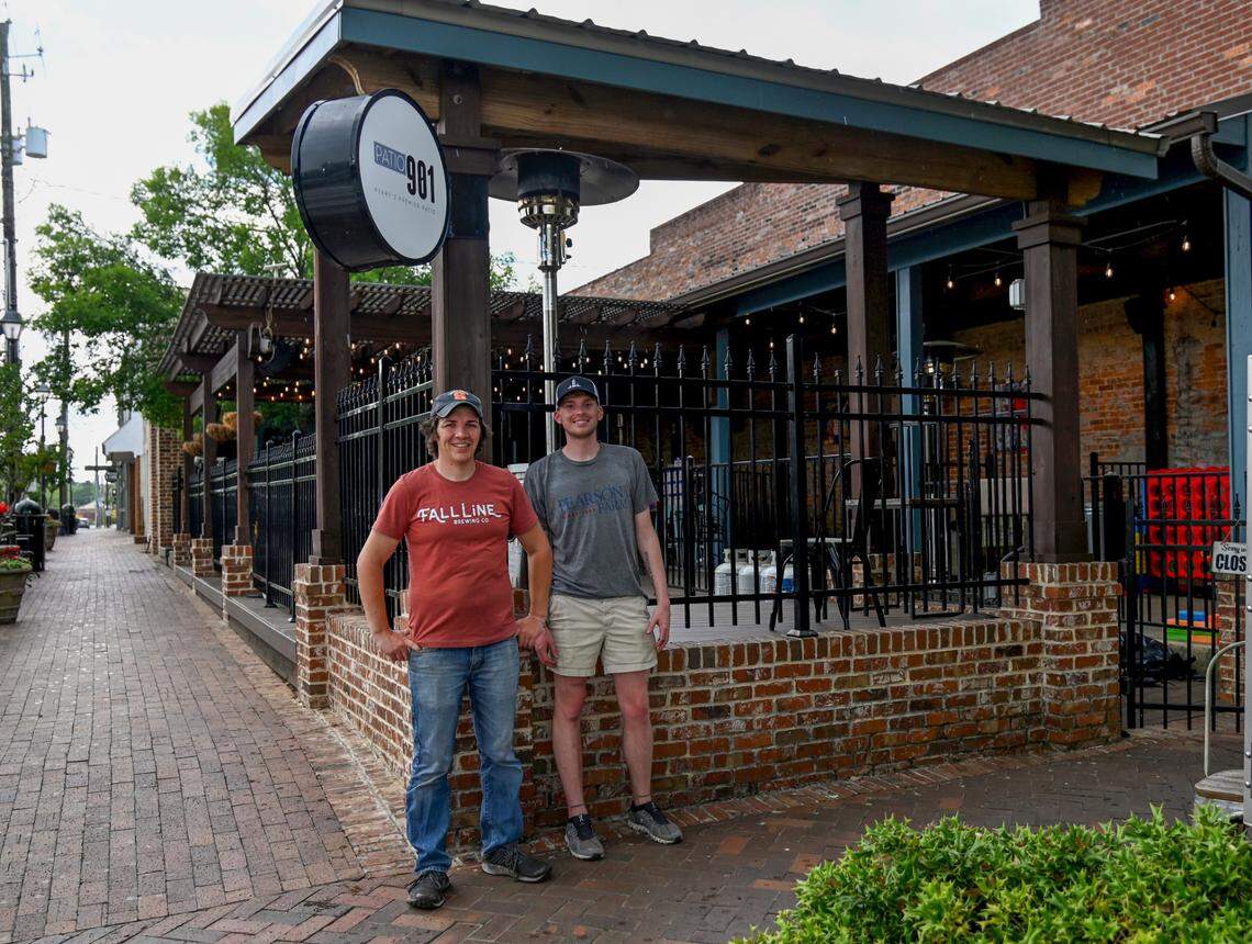 From left, Patio 901 owners Eric Schultz and Charlie Shimp. The business partners have rebranded their popular outdoor venue previously known as Hazard’s on the Green at 901 Carroll St. in downtown Perry.