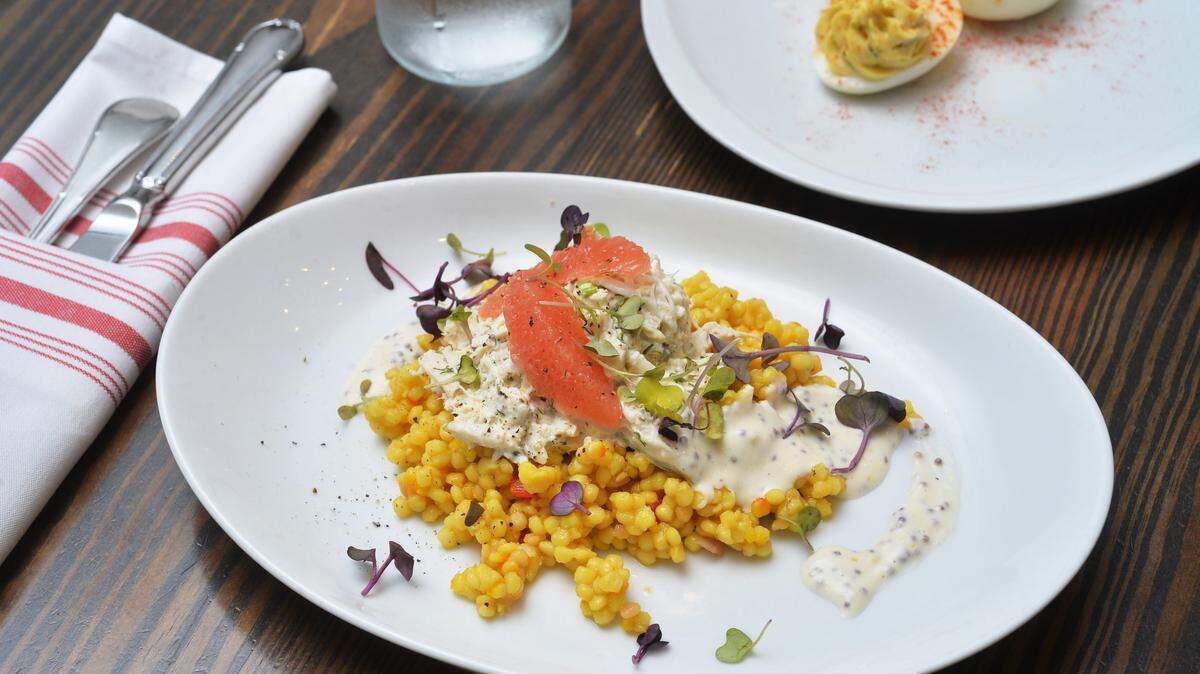 Summer crab at Dovetail in Macon, along with deviled eggs with poblano relish and smoked paprika.