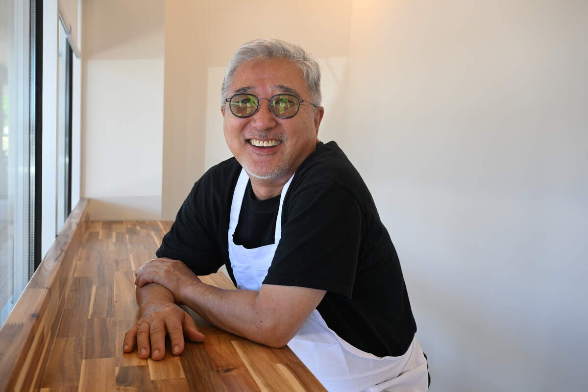 My Favorite Burger owner Hoyung “Steve” Ju poses at the widow seating at the front of his restaurant on Tuesday, June 23, 2026, before the official opening in Warner Robins, Ga.