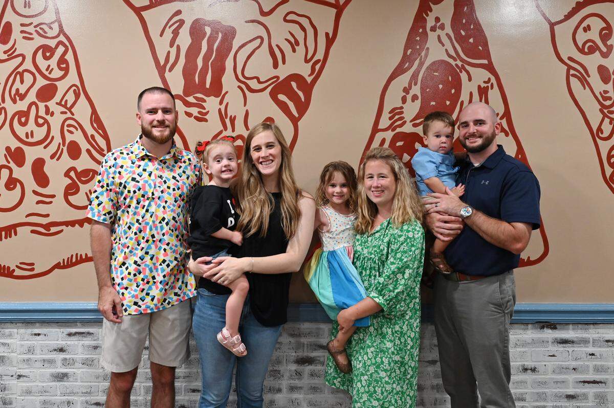 The Klines at their Warner Robins restaurant, My Father’s Place. From left to right Jacob and Hope Kline, with their daughter, Nora, and Jamie and Jonathan Kline, with their daughter, Lakelyn, and son, Beckham.