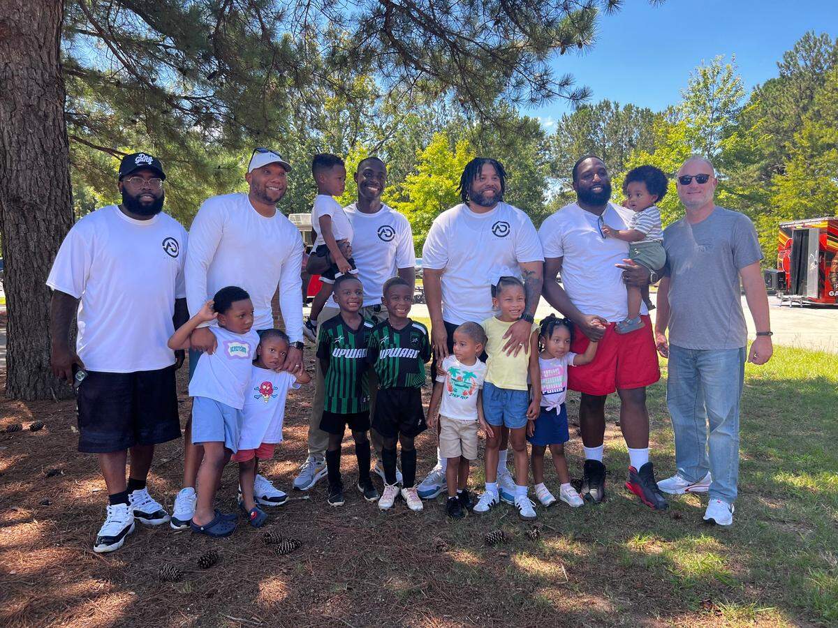 Fathers, male guardians and their kids connected at a social gathering called Ice Cream with Dads at Amerson River Park in Macon, Ga. on August 24, 2024. The event was organized by Macon Mental Health Matters, Macon Violence Prevention and The Active Dad.
