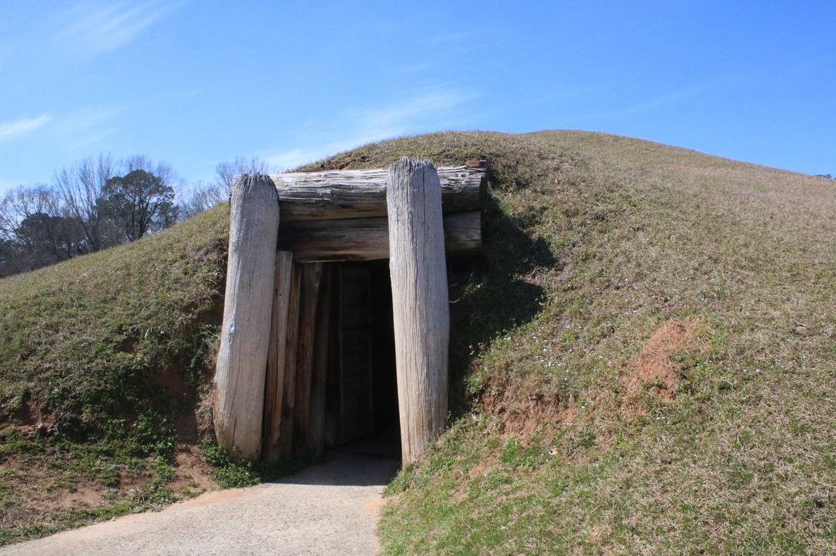The entrance to the Earth Lodge sits along the paved path at Ocmulgee Mounds National Historical Park on Thursday, Feb. 27, 2025, in Macon, Georgia. After a failed effort in 2024, Georgia legislatures reintroduced a bipartisan bill to make the Ocmulgee Mounds Georgia’s first national park on Wednesday.