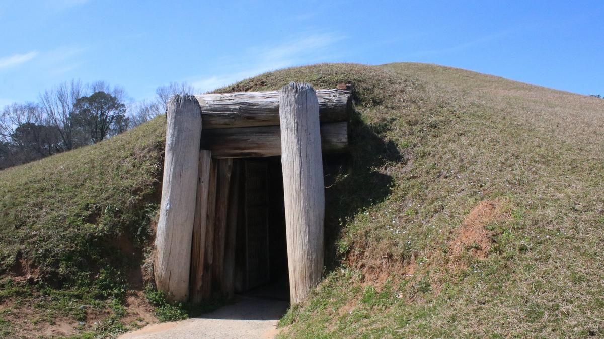 The entrance to the Earth Lodge sits along the paved path at Ocmulgee Mounds National Historical Park on Thursday, Feb. 27, 2025, in Macon, Georgia. After a failed effort in 2024, Georgia legislatures reintroduced a bipartisan bill to make the Ocmulgee Mounds Georgia’s first national park on Wednesday.