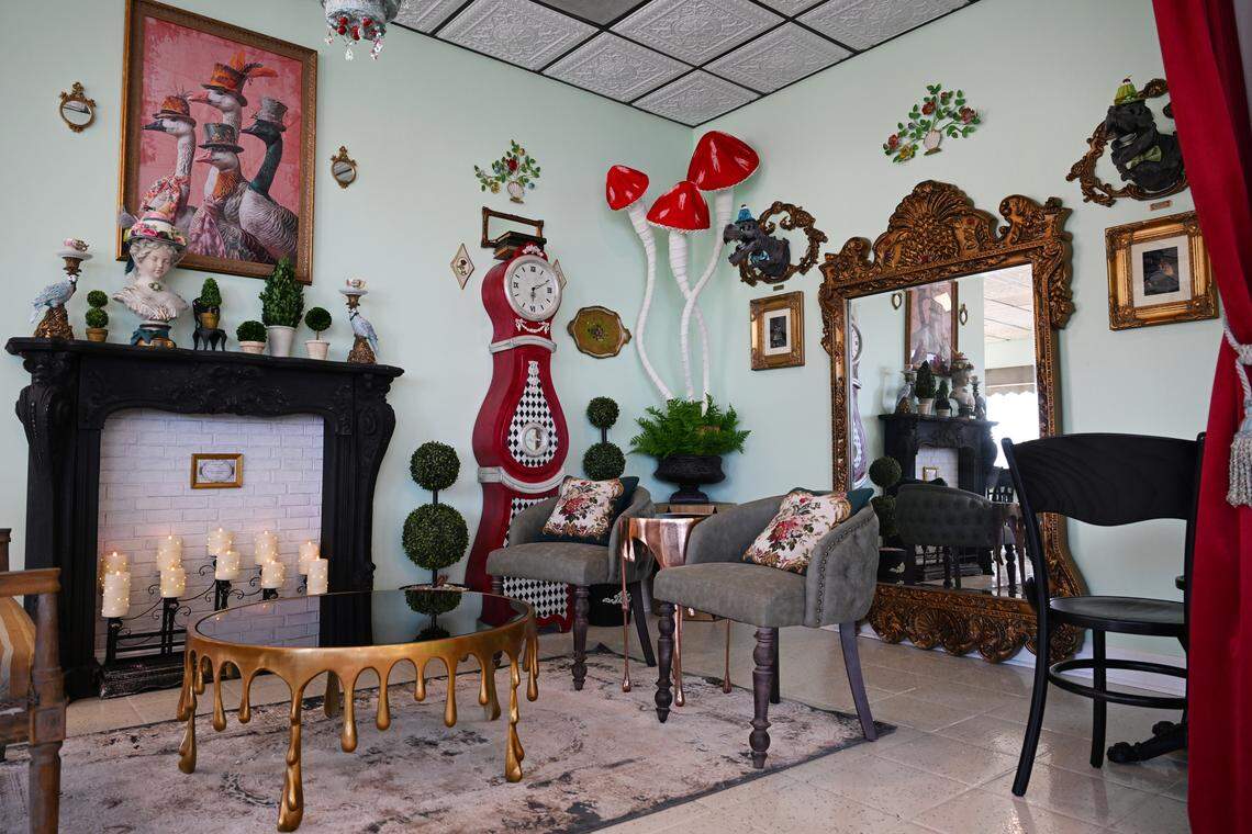 Whimsical decorations, including animals in hats and a painted grandfather clock, sit inside of the new Mad Hatter Cafe & Confections in Warner Robins. Most of the decor inside of the Victorian themed cafe was created or redesigned by the Saunders.