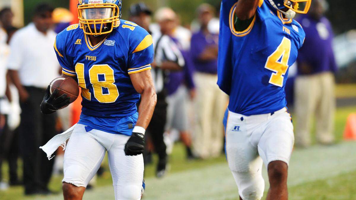 Fort Valley State safety George Maxey (18) heads toward the end zone with the pass he intercepted in the first half Saturday against Benedict.