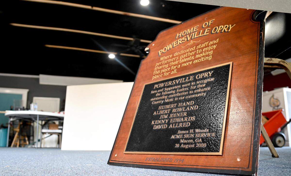 A Powersville Opry sign sits on the floor at the Opry’s new location in Hawkinsville March 31. The Opry is moving to Hawkinsville after 27 years at its former location outside of Byron.