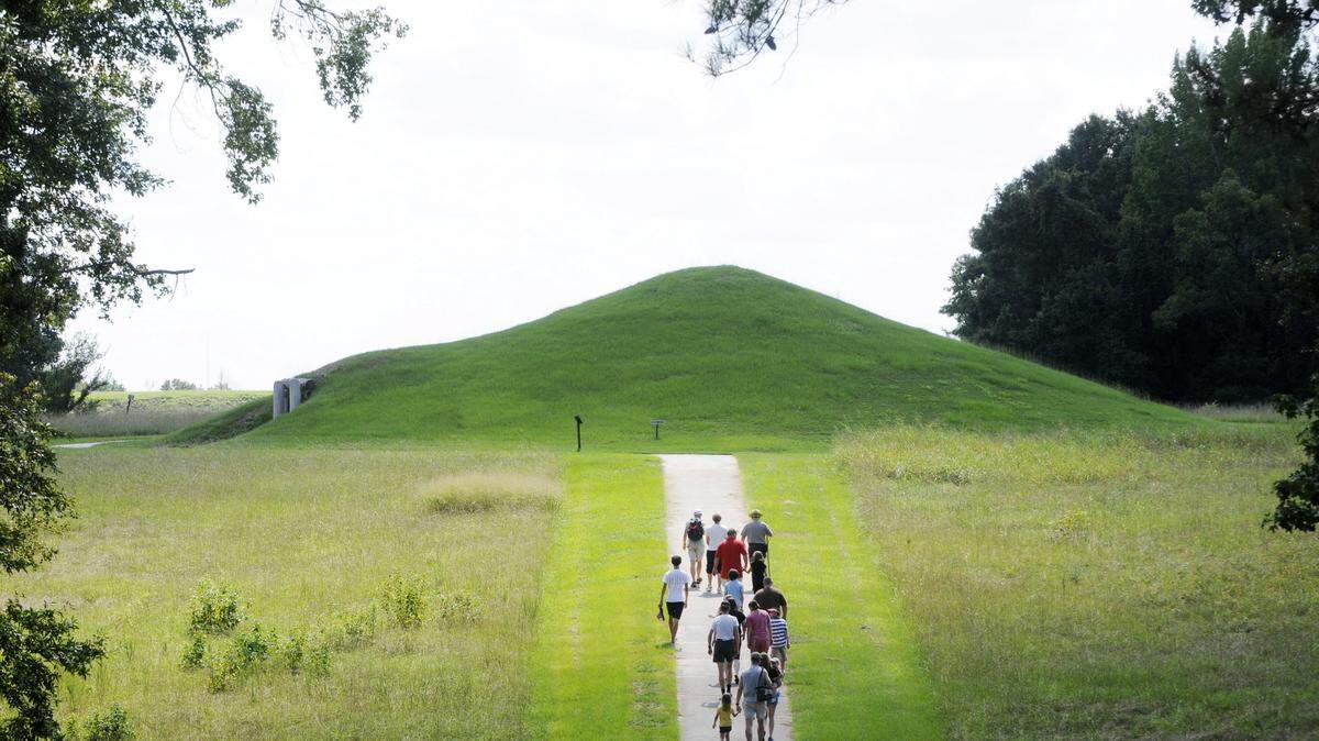 THE TELEGRAPH 
 Visitors to the Ocmulgee National Monument walk the path to the Earth Lodge.