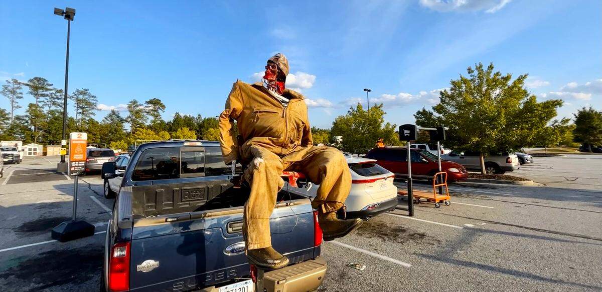 A homemade skeleton-monster mounted on a toilet seat on the back of a Macon, Georgia, man’s pickup truck is turning heads.