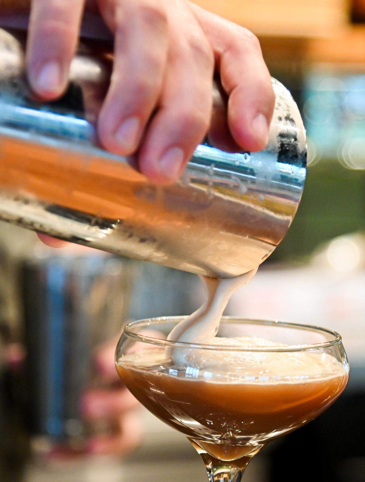 Hunter Hawkins pours a Cafe Romano house cocktail into a glass at Longleaf Distillery at 664 Second St. in downtown Macon.