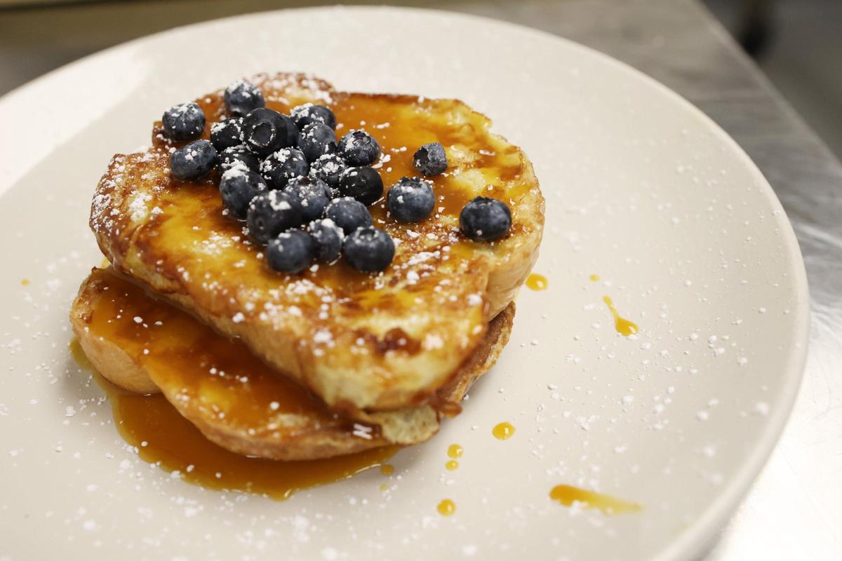 A French toast dish from Loom’s breakfast menu sits on the countertop in the kitchen at Loom inside of Hotel Forty-Five on Tuesday, Aug. 6, 2024, in downtown Macon, Georgia. Tuesday marked only the second day of breakfast service at Loom, a new addition since Reynolds’ hiring. Reynolds said that he is still working to perfect the menu and establish an identity for Loom under his leadership.