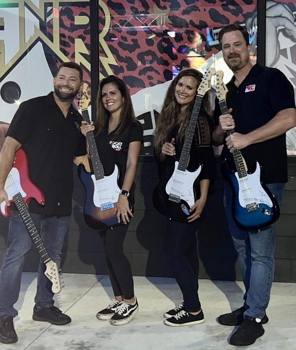 Rock N Roll Sushi owners Tim and Alisa Prussia, on the right, with their Rock N Roll Sushi business partner, Eric Robison, and his fiancee, Toni Powell, at the new and Macon;s first Rock N Roll Sushi location at 5791 Zebulon Road, Suite D.