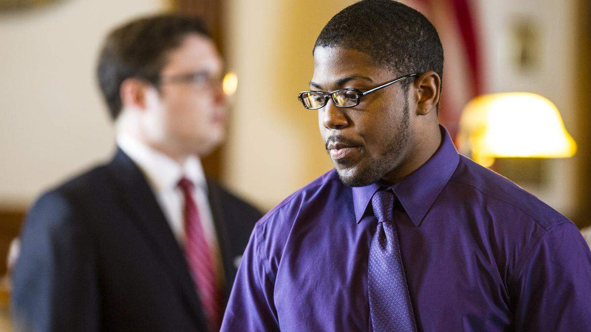 Marquez Deshawn Martin walks back to the defense table in court Monday. Martin is on trial for the May 6, 2013, Monroe County killing of Russell Jacobs, 36, and James Pittman Wood, 40.
