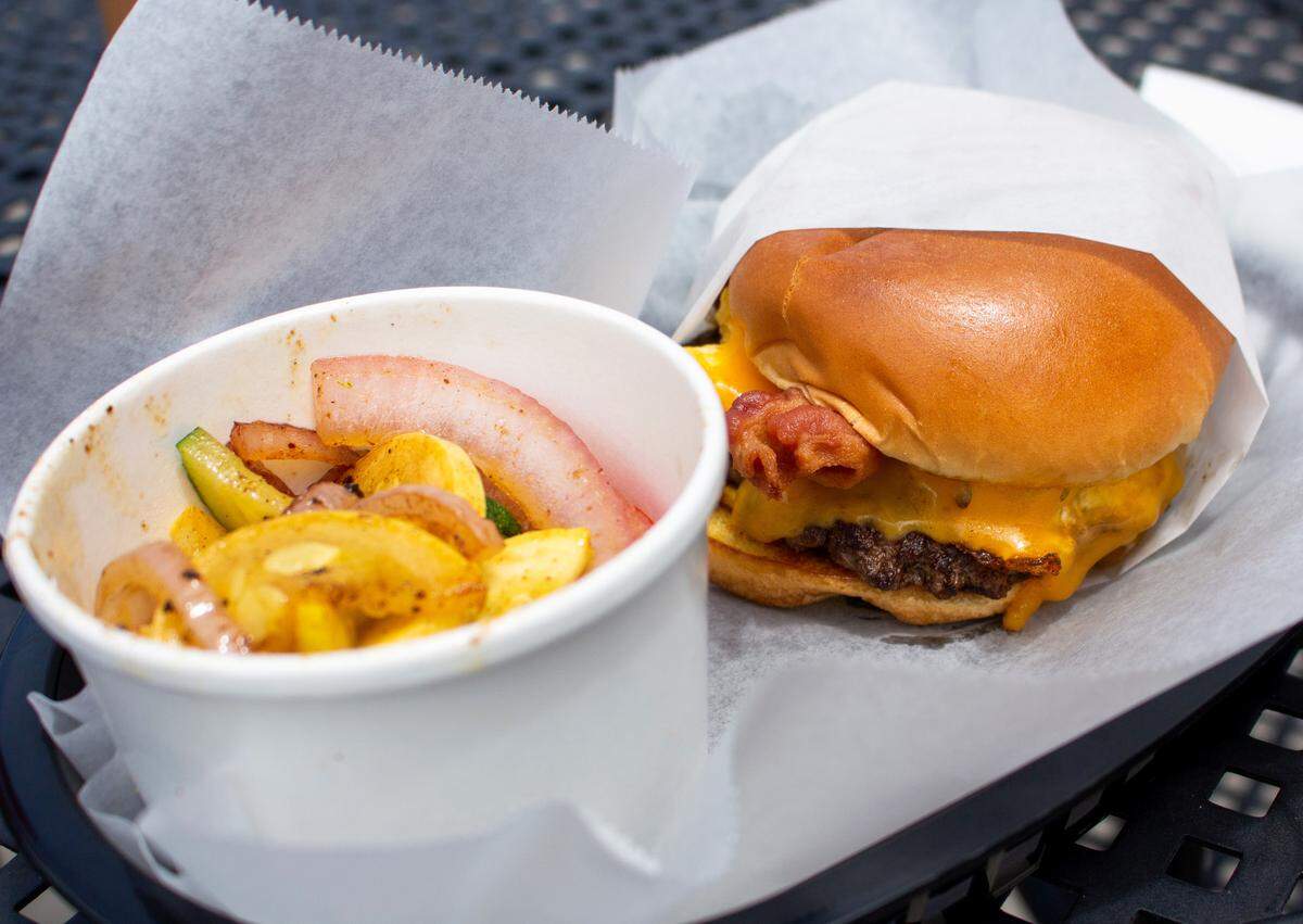 A brunch burger with a side of mixed veggies at The Library Taphouse and Kitchen located at 1530 Mercer University Drive, Suite 300, in Macon.