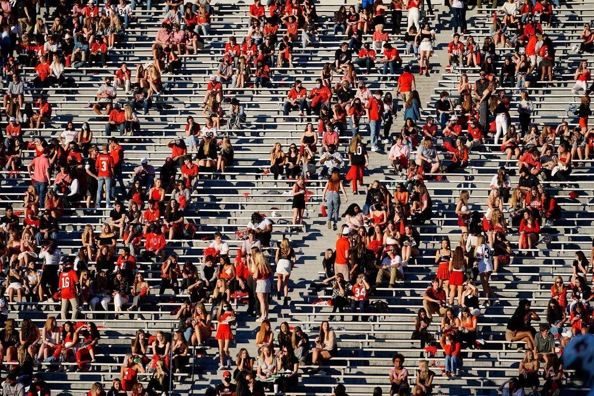 Georgia students gather in the stands before an NCAA college football game against Auburn, Saturday, Oct. 3, 2020, in Athens, Ga. (AP Photo/Brynn Anderson)