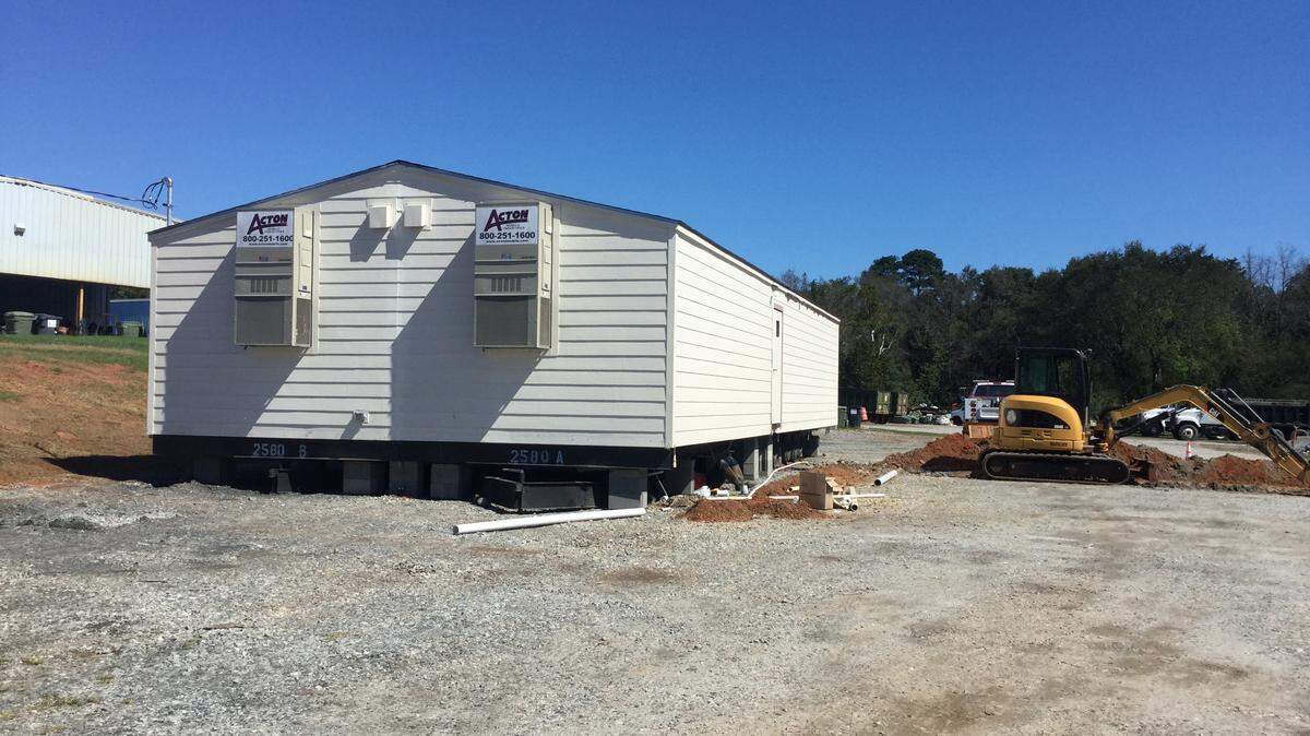 A new building donated by Houston Healthcare is being secured at the city of Perry’s animal shelter on Ball Street.