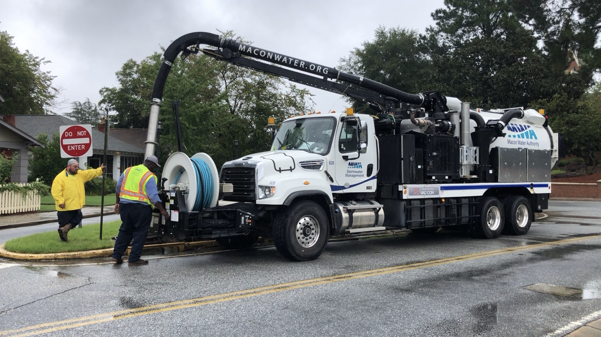 A Macon Water Authority Stormwater Management crew unclogs a storm sewer after flash flooding in Mercer Village last fall.