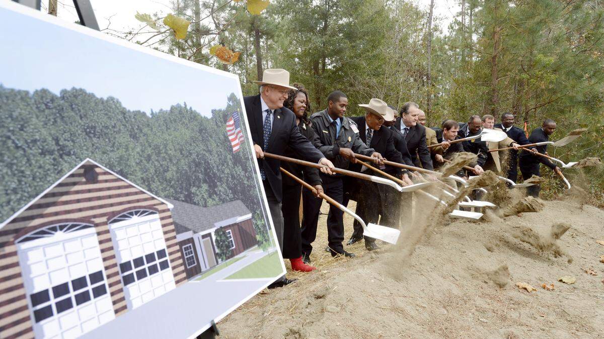 County officials break ground on what would have been the site of future Macon-Bibb Fire station No. 111 in this 2013 file photo.