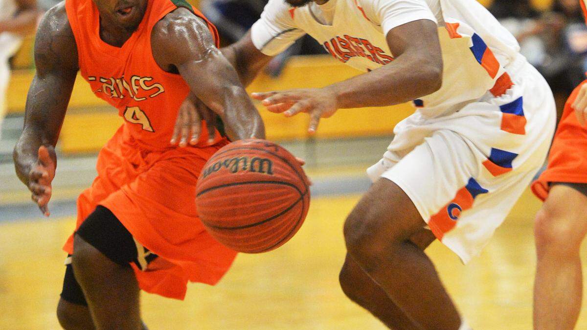 BEAU CABELL/THE TELEGRAPH 
 Macon, Ga., 01/15/2016: Rutland guard Ladarian Womack (4) makes a steal on Central's Derrick Evans, Jr. (14).