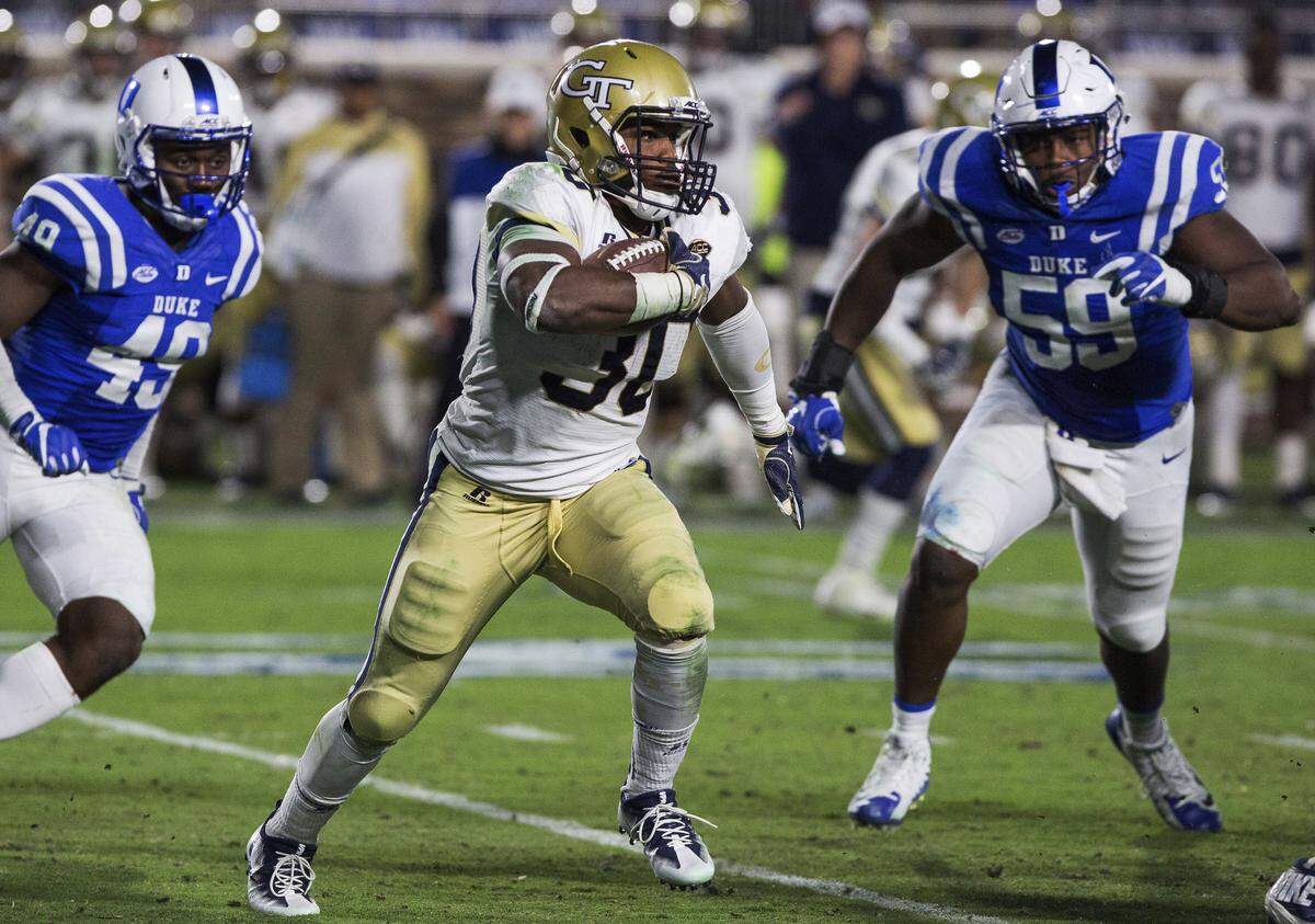 Georgia Tech's KirVonte Benson (30) carries the ball against Duke.