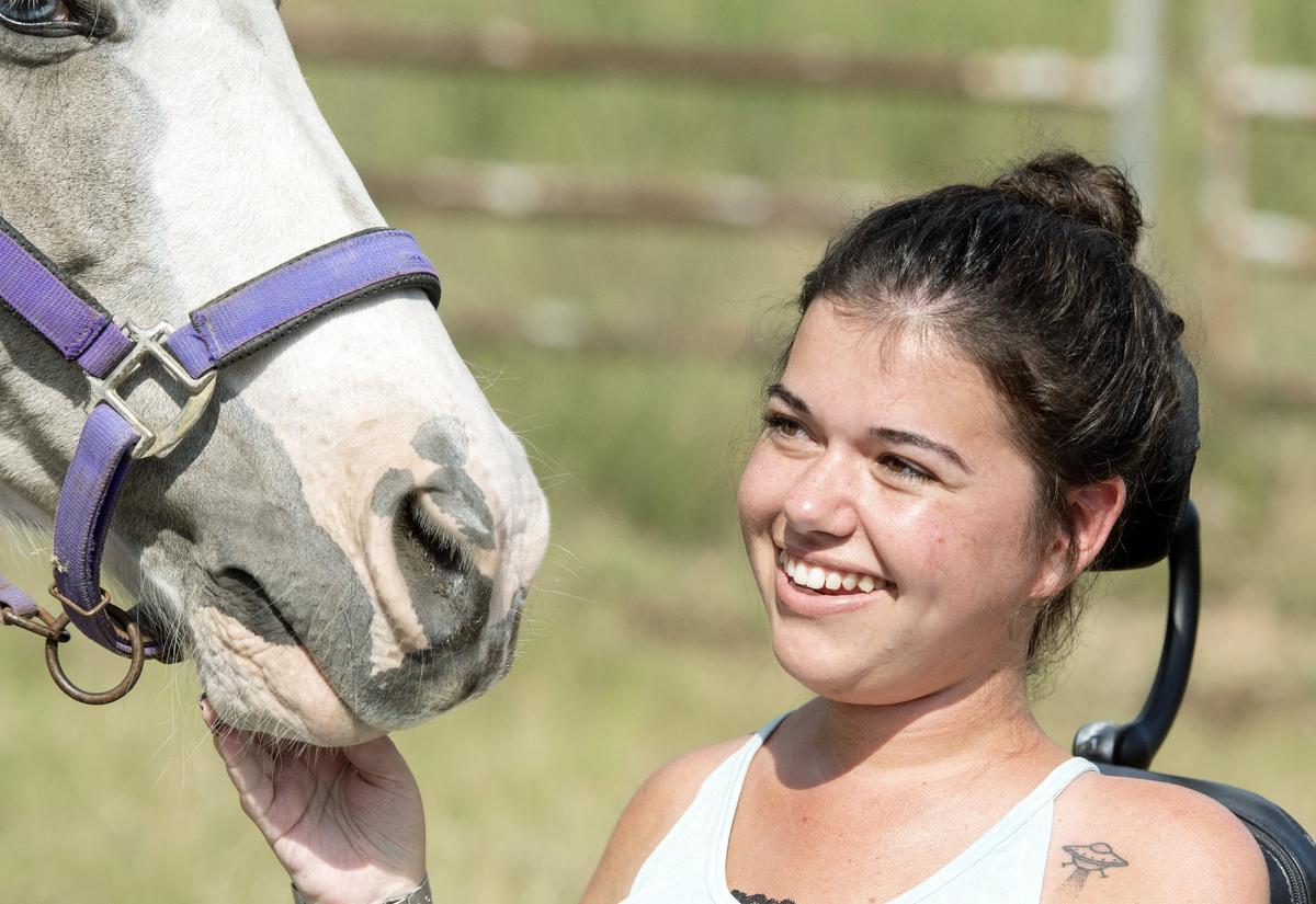 Wesleyan senior Samantha Camp cracks a smile Tuesday afternoon while speaking with a Telegraph reporter during an equine therapy class.