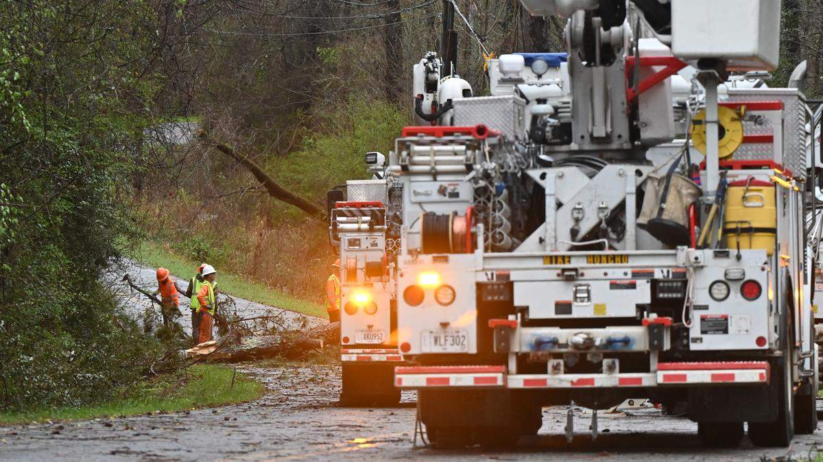 Crews from Georgia Power removed limbs from off the road at North Mumford Road on Thursday, March 12, 2026, in Macon, Georgia. Severe storms early Thursday morning resulted in several outages and road closures.