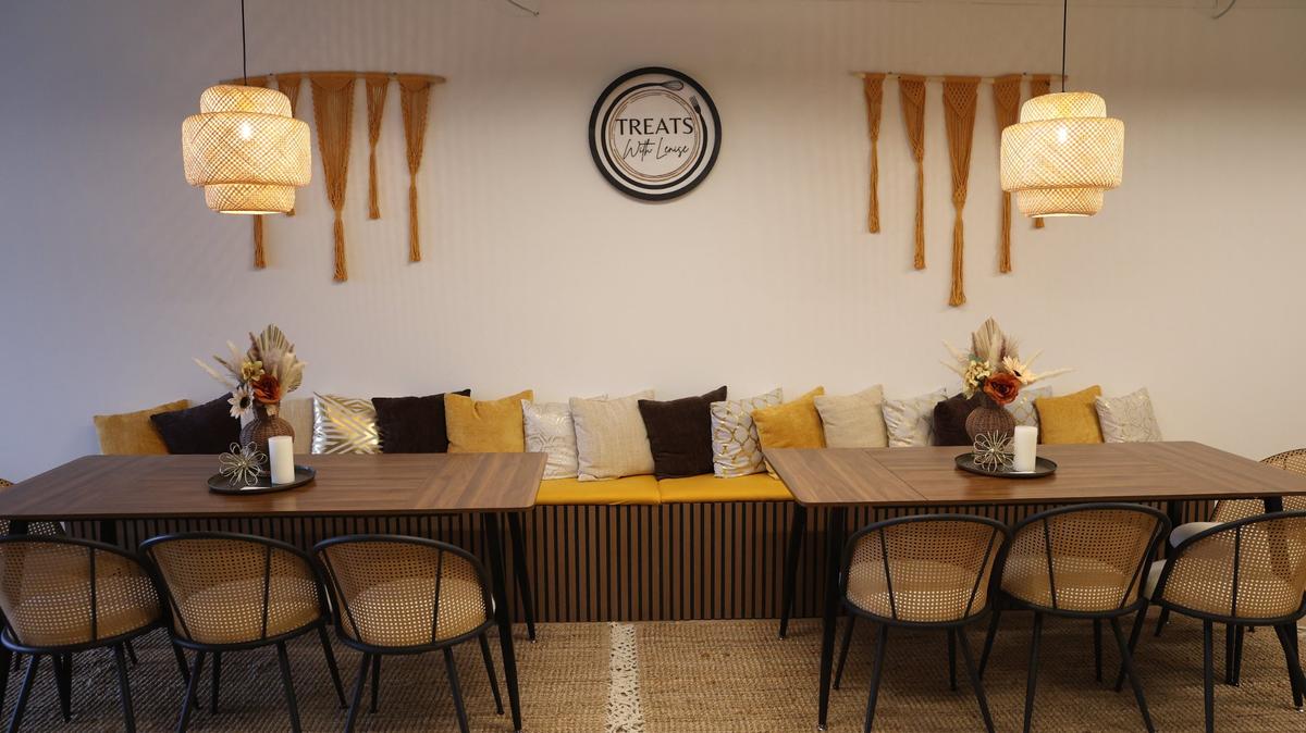 A sitting area sits inside of Treats with Lenise on Tuesday, Feb. 11, 2025, in downtown Forsyth, Georgia. The bakery, which started in 2023 as a catering business, plans to open its doors on Friday for Valentine’s Day.