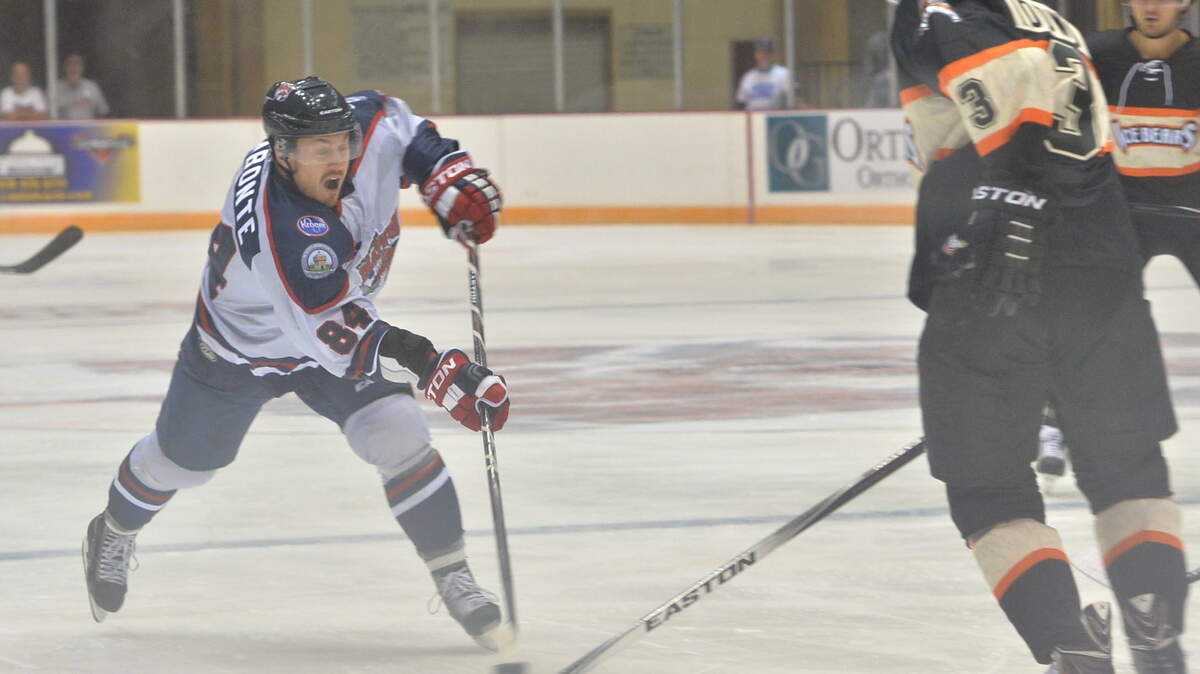 BEAU CABELL/THE TELEGRAPHMacon wing Alex Labonte sends a slap shot toward the goal during first-period action against Knoxville on Friday during the Mayhem's season opener.