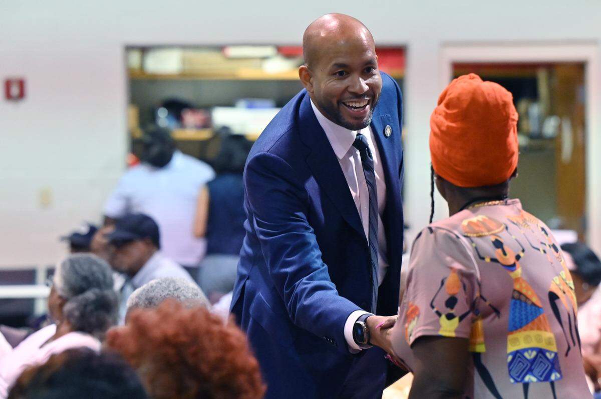 Georgia state senator and gubernatorial candidate Jason Esteves (left) shakes the hand of an attendee at the “Meet & Greet Your Next Governor of Georgia” panel on Wednesday, Aug. 20, 2025, at First Baptist Church New Beginnings Center in Warner Robins, Georgia. Esteves and seven other candidates shared their platforms in person and virtually at the event hosted by the Houston and Bibb County NAACP chapters.