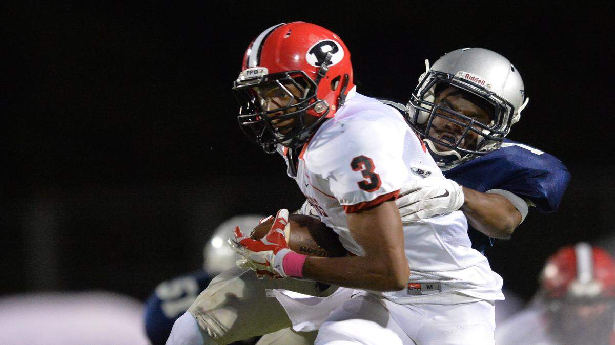 EVAN RODENROTH/For The TELEGRAPH,Warner Robins, Georgia, 10/02/2015: FPD Viking Armaun Smith gets brought down from behind by Stratford Eagle Quintez Cephus Friday night.