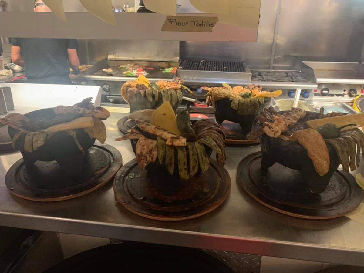 Molejeta dishes fresh off the grill at Fajitas Mexican Grill at 4696 Presidential Parkway in Macon. The dish includes sliced, grilled cactus, chicken breast, shrimp and steak, bell peppers, hot peppers and a spicy sauce. The restaurant now has a second location at 6012 Zebulon Road.