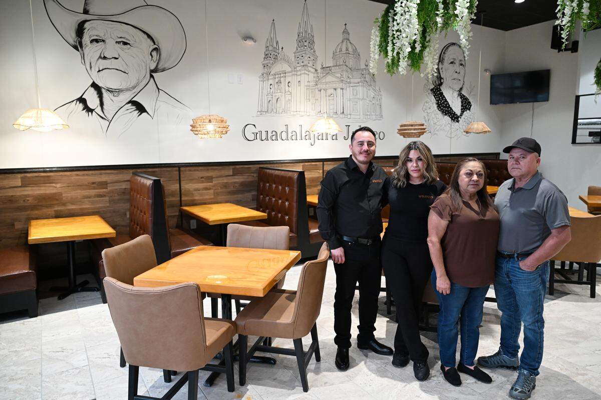 From left to right: El Metate Cantina Mexicana owners Fernando and Yuliana Barradas pose with her parents, Ricardo Gonzalez and Hilda Garcia, inside their new restaurant in Perry, Ga. The Perry location will be the couple’s fourth Mexican restaurant in the area. They have fifth restaurant coming to Stone Mountain next year.