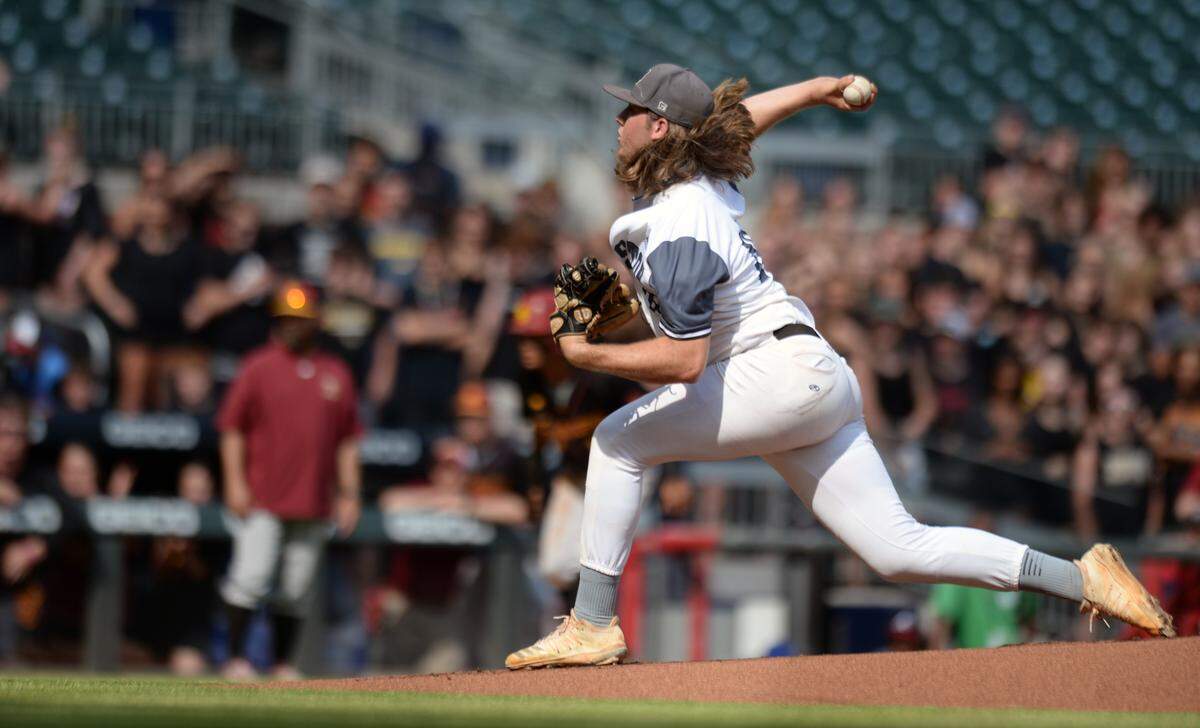Houston County pitcher Brodie Chestnutt (10) delivers a pitch to the plate during game one of the BearsÕ GHSA 6A Championship series against Lassiter Wednesday in Atlanta.