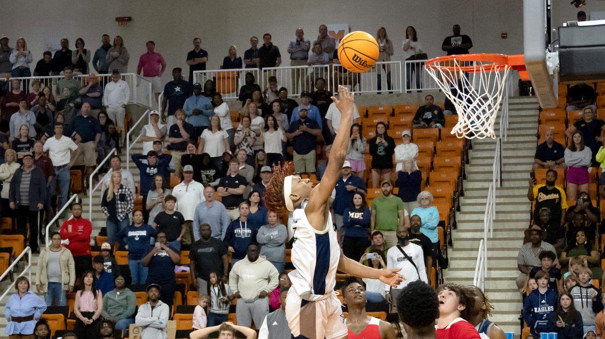 Stratford guard Khalil Green lays in the game-tying shot while getting fouled in the final seconds of the Eagles’ 65-64 GIAA State Championship win over St. Anne-Pacelli Saturday night at Mercer.