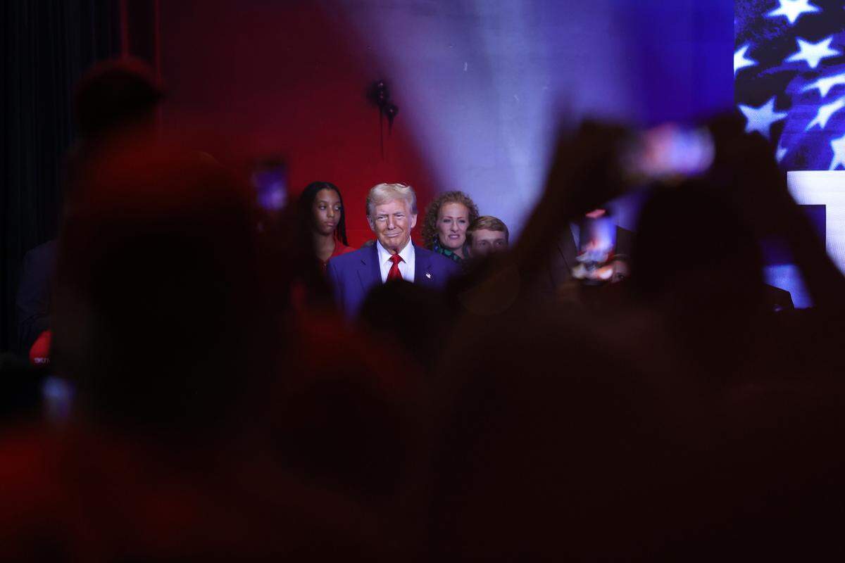 Republican presidential nominee Donald Trump smiles at the crowd as he entered the stage for the Believers and Ballots Faith Town Hall on Wednesday, Oct. 23, 2024, at Christ Church Zebulon in Zebulon, Georgia. In the first of two Georgia campaign events Wednesday, Trump took questions from Zebulon community members.