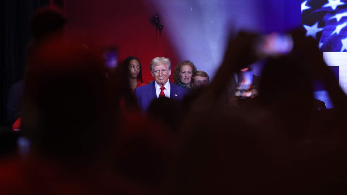 Republican presidential nominee Donald Trump smiles at the crowd as he entered the stage for the Believers and Ballots Faith Town Hall on Wednesday, Oct. 23, 2024, at Christ Church Zebulon in Zebulon, Georgia. In the first of two Georgia campaign events for the day, Trump took questions from Zebulon community members.