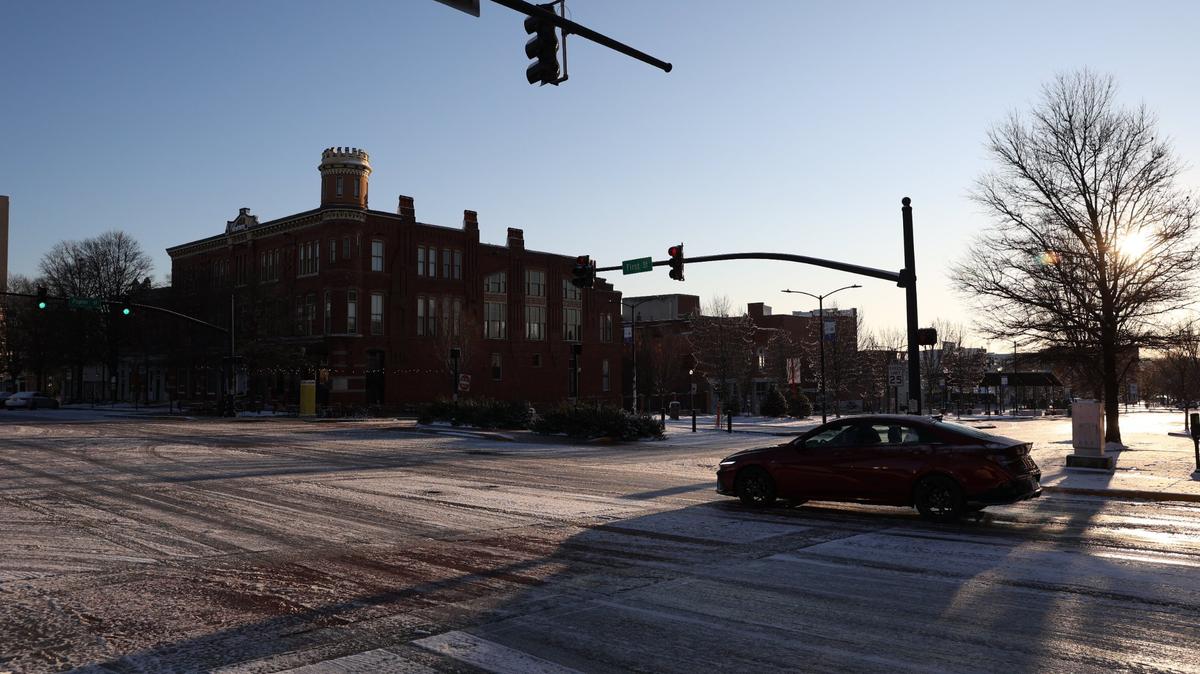 A car drives through icy roads on First Street on the morning of Wednesday, Jan. 22, 2025, in downtown Macon, Georgia. An estimated 2-3 inches of snow accumulated in most of Middle Georgia yesterday afternoon, with freezing temperatures and slippery roads remaining.