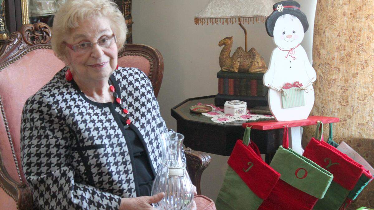 Barbara Shaheen holds her Community Service Award in December 2014. Shaheen received the award from Georgia Military College, her alma mater.
