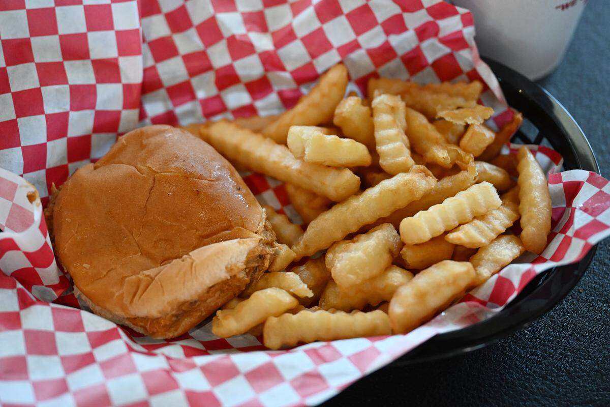 The “Pig” pulled pork sandwich served with fries from Fincher’s Barbecue on South Armed Forces Boulevard in Warner Robins.