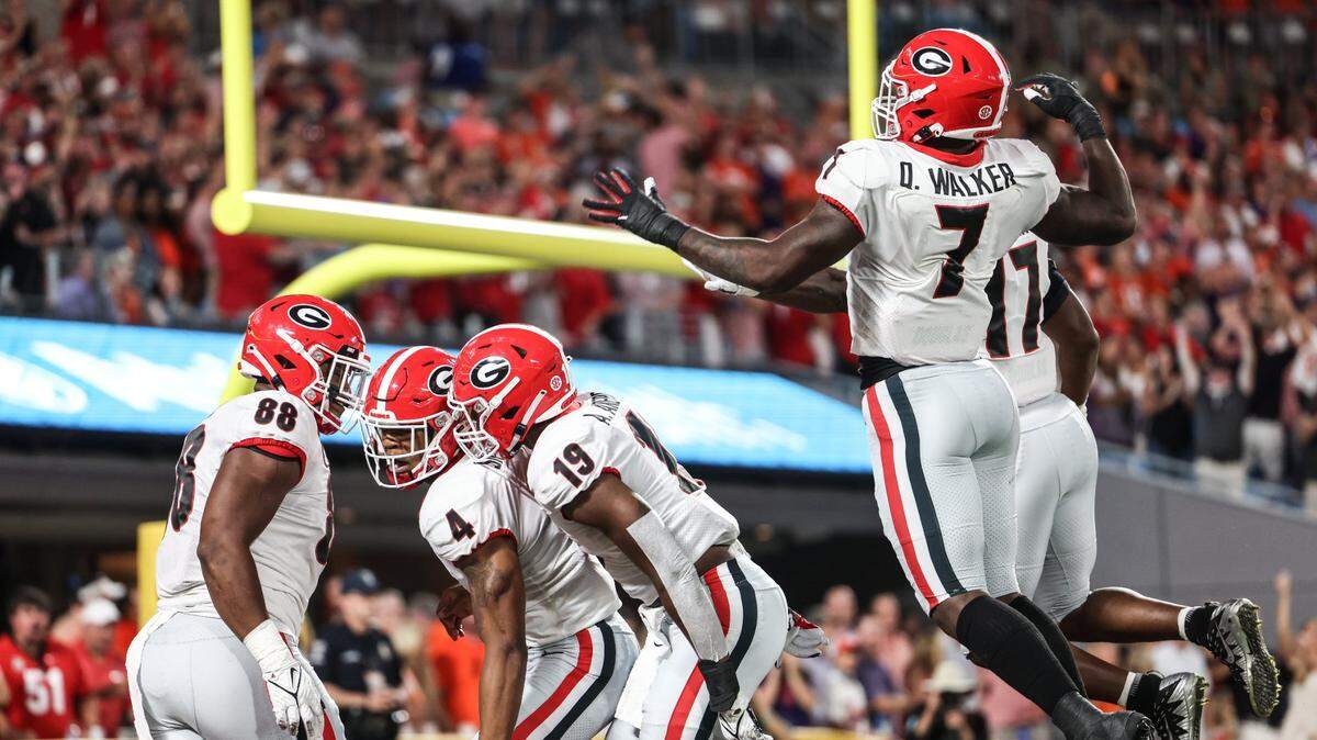 Georgia players celebrate during the Dukes Mayo Classic at the Bank of America Stadium in Charlotte, N.C., on Saturday, September 4, 2021.