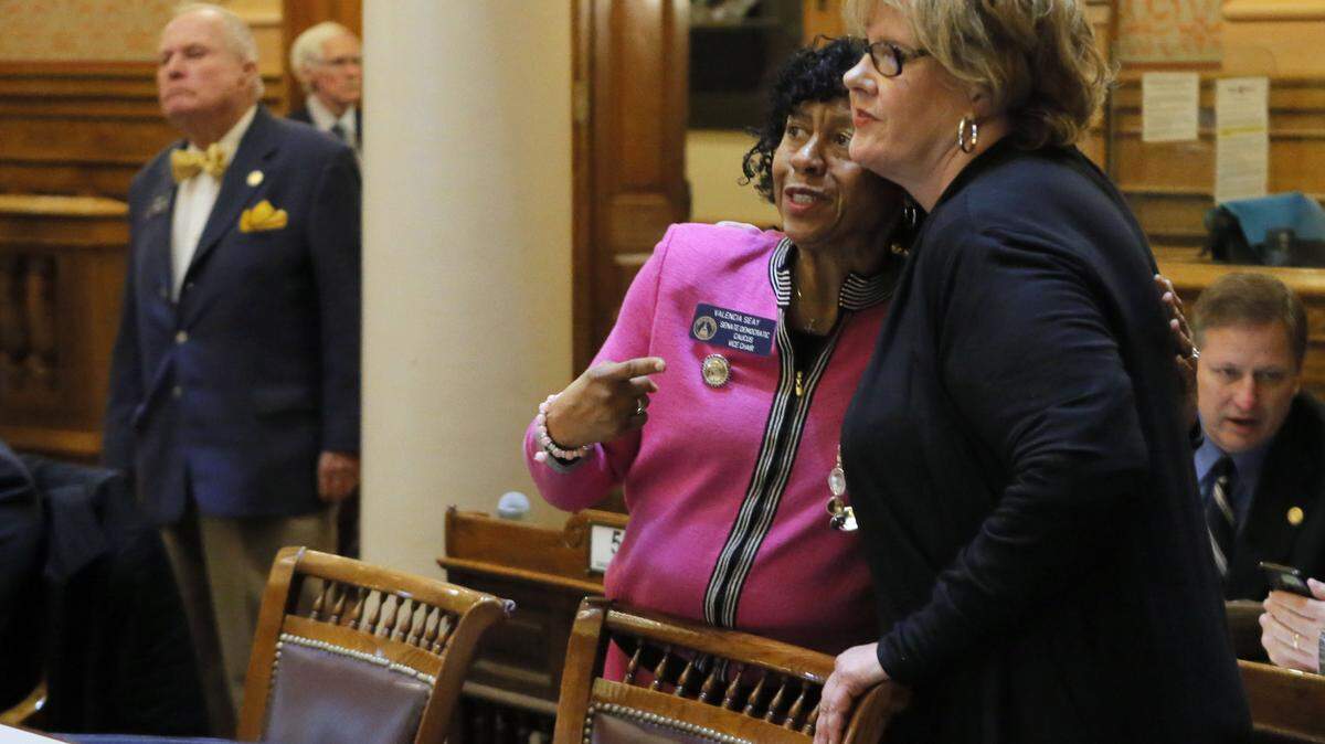State Sen. Renee Unterman, right, and Sen. Valencia Seay watch the vote come in for Senate Bill 352, which Unterman sponsored. The bill, passed by the Senate on Feb. 7, aims to get control of the opioid crisis in Georgia.