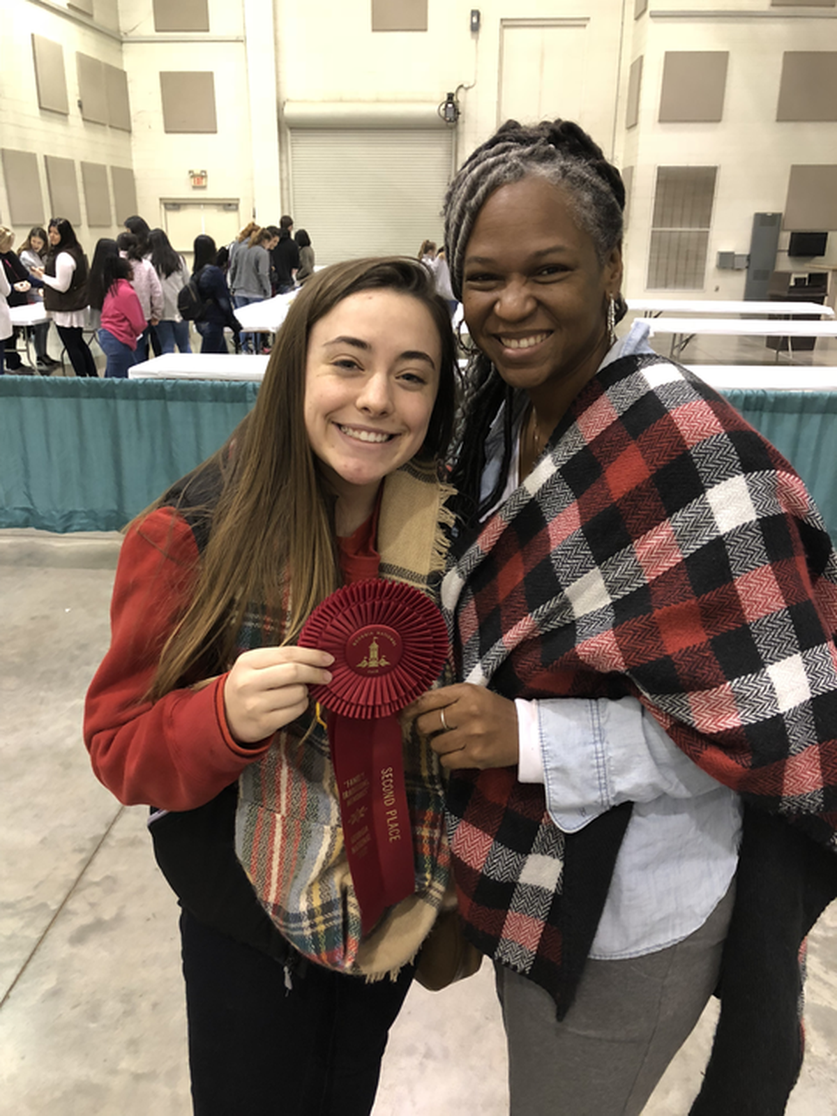 Erica Alcox, a former high school nutrition teacher in DeKalb County, poses with a student who won an award at the Georgia National Fair.