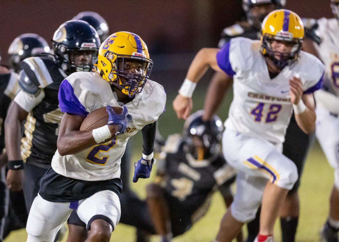 Crawford County receiver Terrel Ashley (2) scampers for a touchdown in Friday’s 44-20 win over Twiggs County.