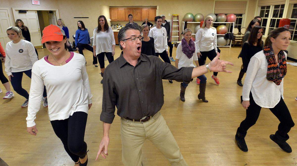 Matthew Jerles, center, sings "Shake a Leg'' with 28 dancers during a rehearsal for the Macon Civic Club's "Macon Music" show, which raises money for many local charities. The show runs Feb. 3-6 at the Grand Opera House.