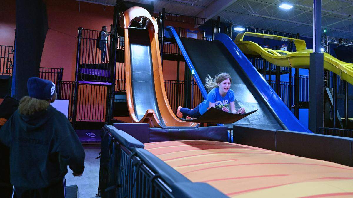 Abigail Mihalek flies down the launch slide at Sky Zone in Warner Robins, Georgia, on Tuesday, March 16, 2026.
