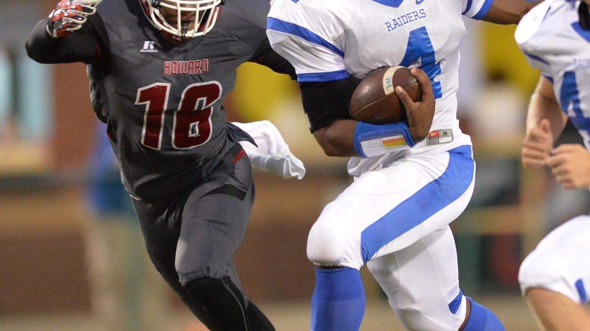 EVAN RODENROTH/For The TELEGRAPH,Warner Robins, Georgia, 09/25/2015: Howard defender Quintarious Jackson moves in to make the tackle on West Laurens running back Darius Bradford.