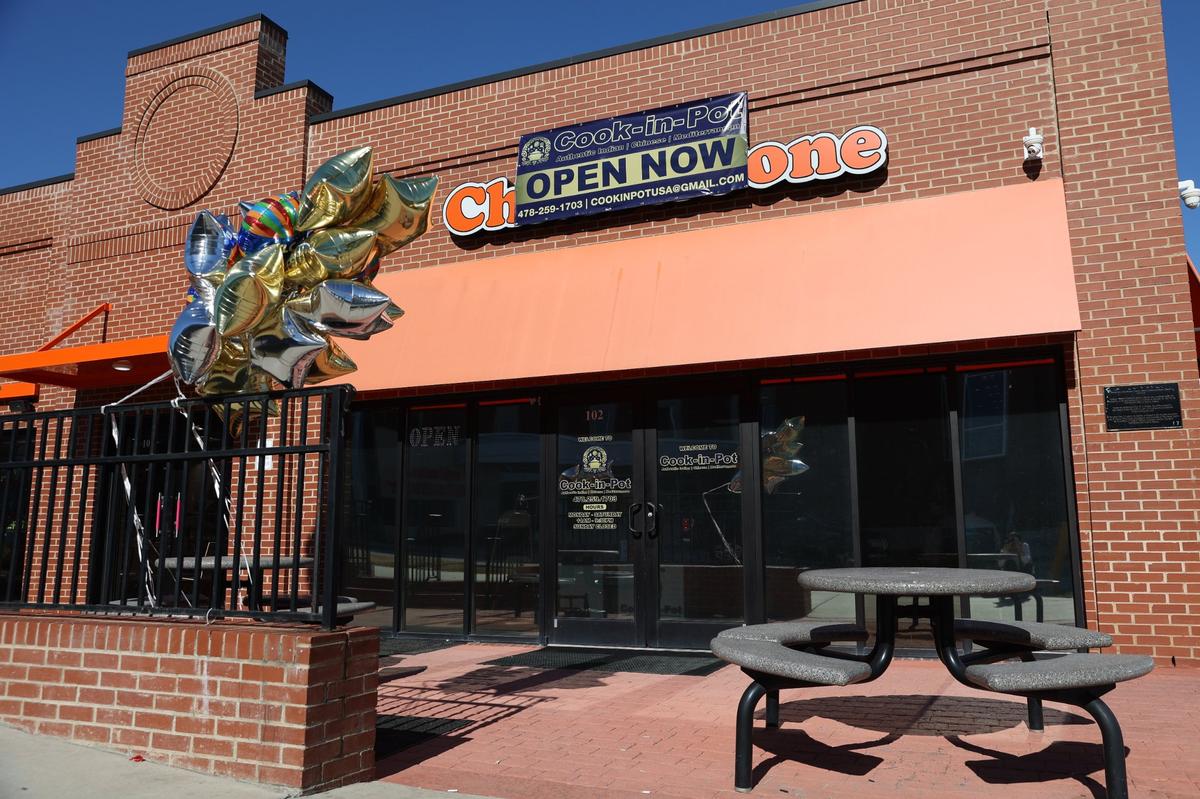 Balloons hang outside of the newly opened restaurant Cook-in-Pot on Forsyth Street on Tuesday, Feb. 4, 2025, in downtown Macon, Georgia. The new restaurant opened February 1 and offers a wide variety of authentic Indian, Mediterranean and Indo-Chinese dishes.